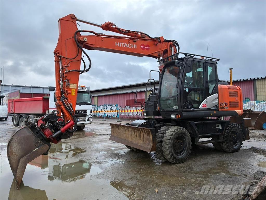 Hitachi ZX140W Pelle sur pneus