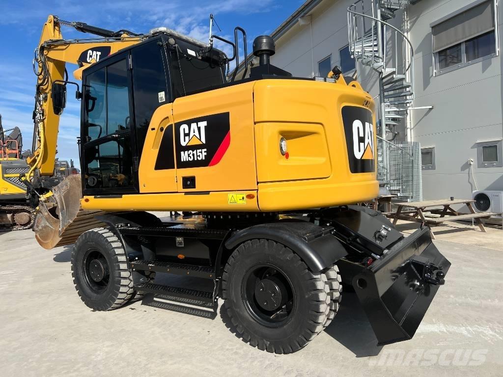 CAT M 315 F Pelle sur pneus