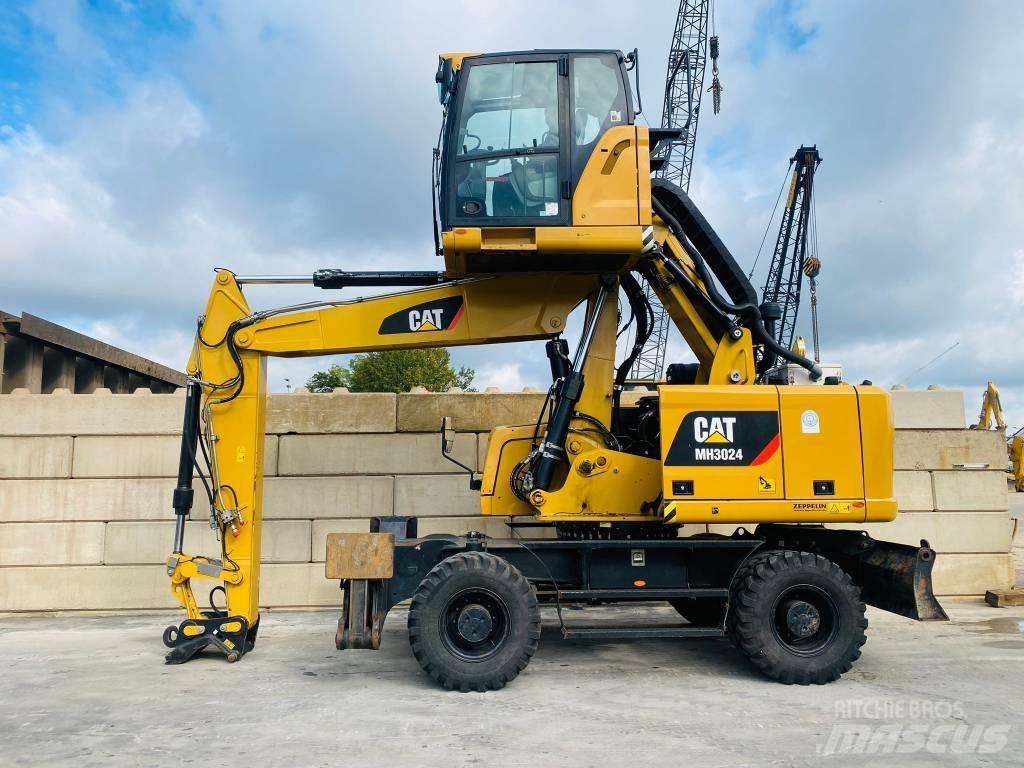 CAT mh3024 Pelle sur pneus