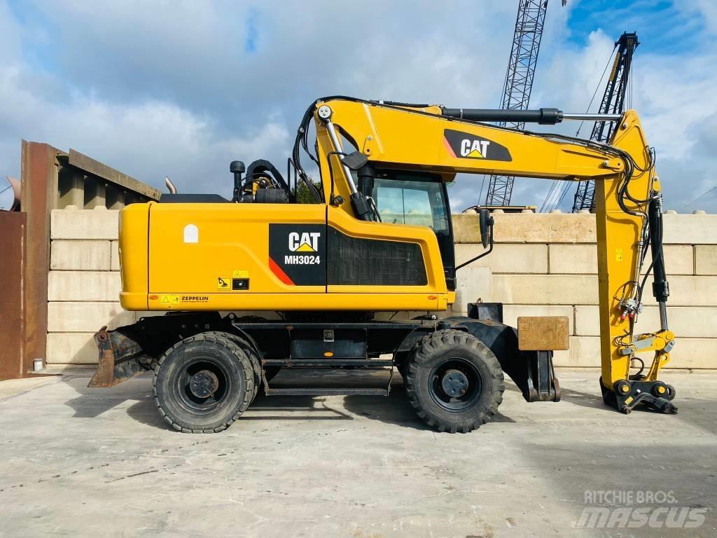 CAT mh3024 Pelle sur pneus