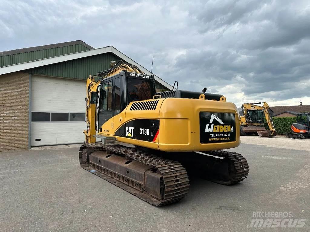 CAT 319D Pelle sur chenilles