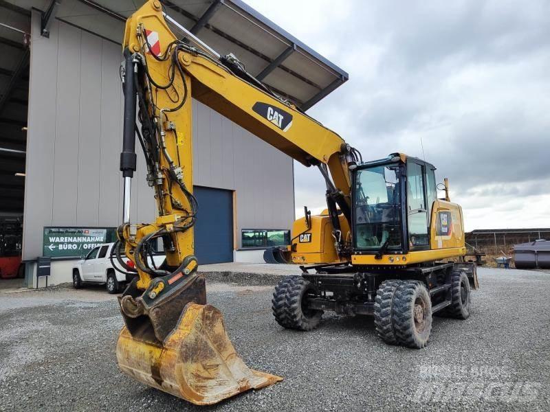 CAT M318F Pelle sur pneus