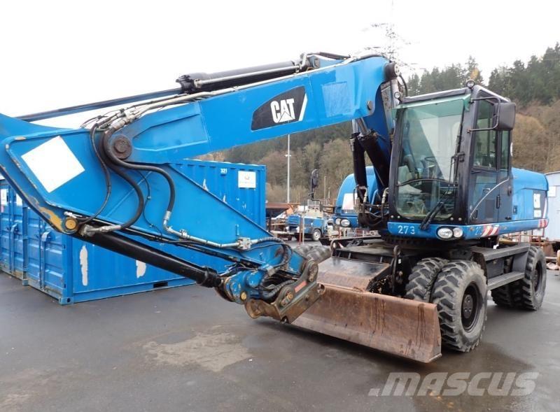 CAT M322D Pelle sur pneus