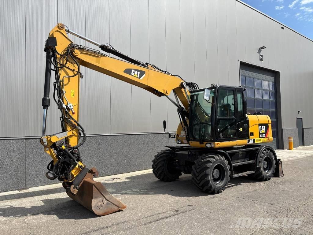 CAT M 313 D Pelle sur pneus