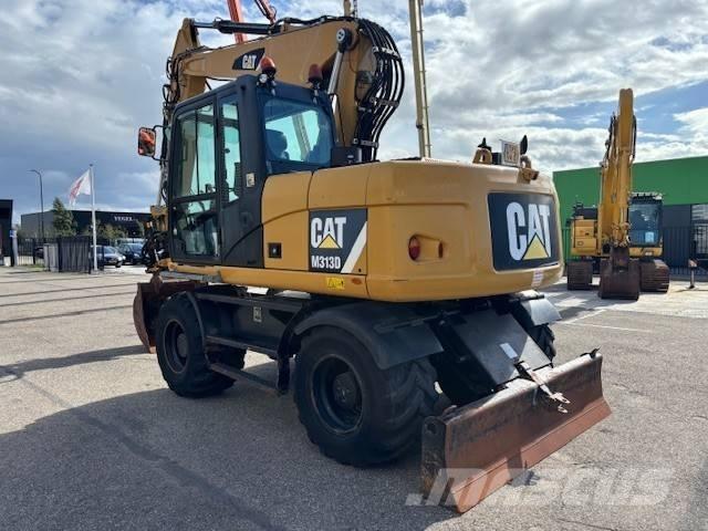 CAT M 313 D Pelle sur pneus