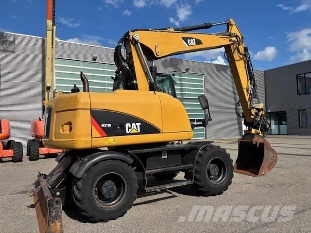 CAT M 313 D Pelle sur pneus