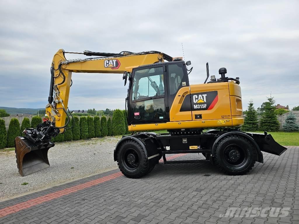 CAT M 315 F Pelle sur pneus