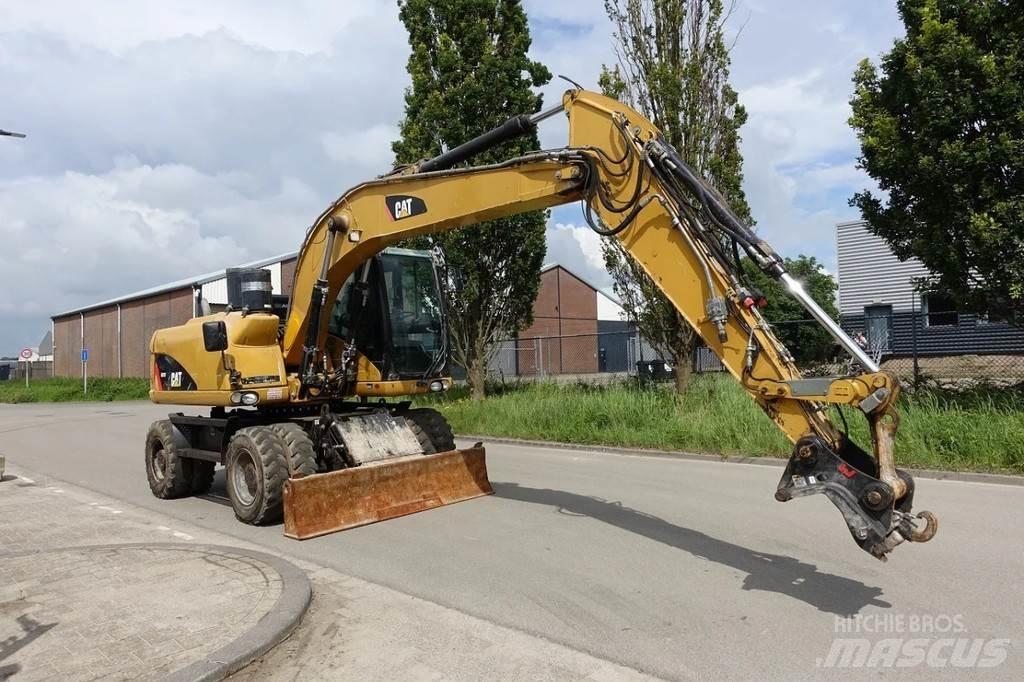 CAT M313 D Pelle sur pneus
