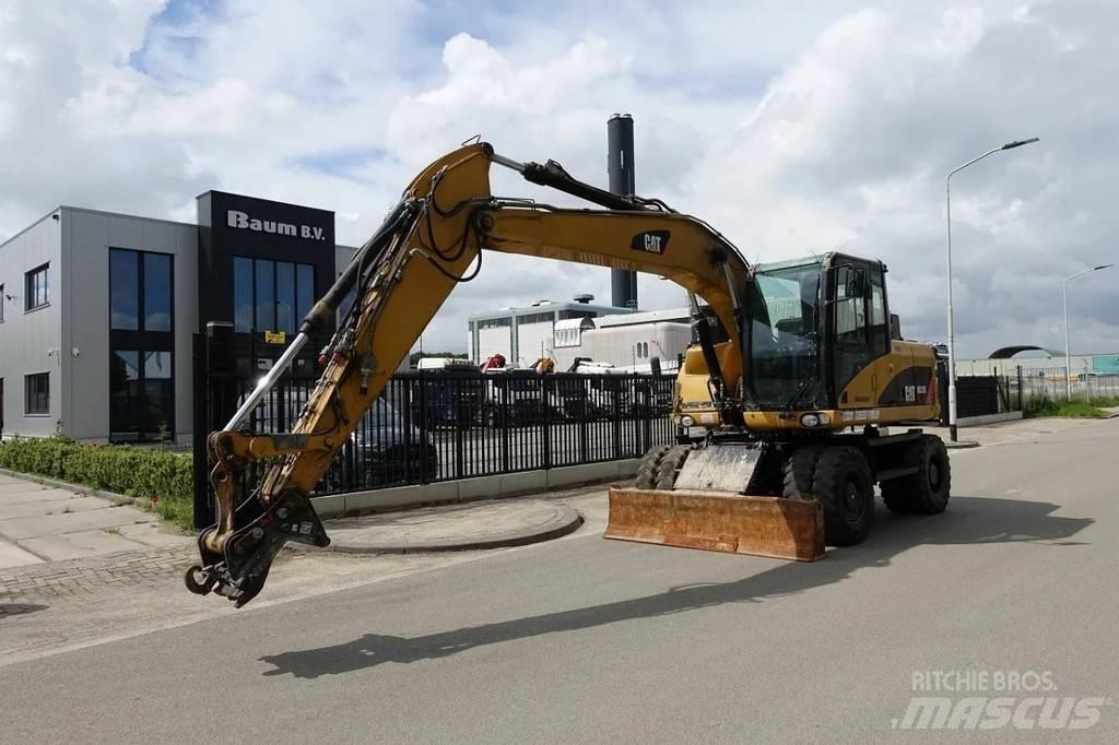 CAT M313 D Pelle sur pneus