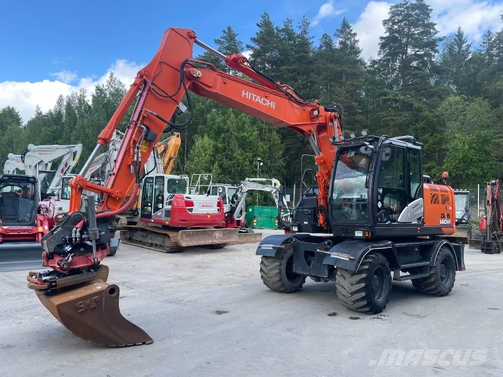 Hitachi 140W Pelle sur pneus