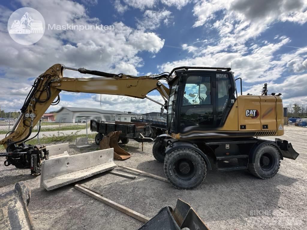 CAT M 314 Pelle sur pneus