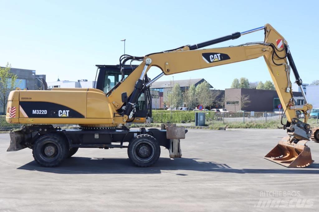 CAT M322D Pelle sur pneus