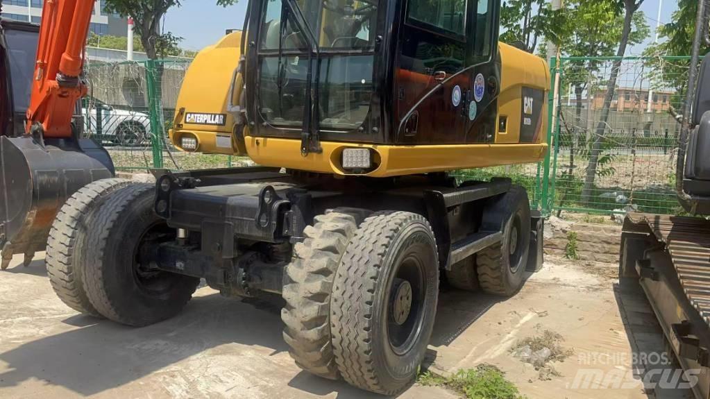 CAT 315 D Pelle sur pneus