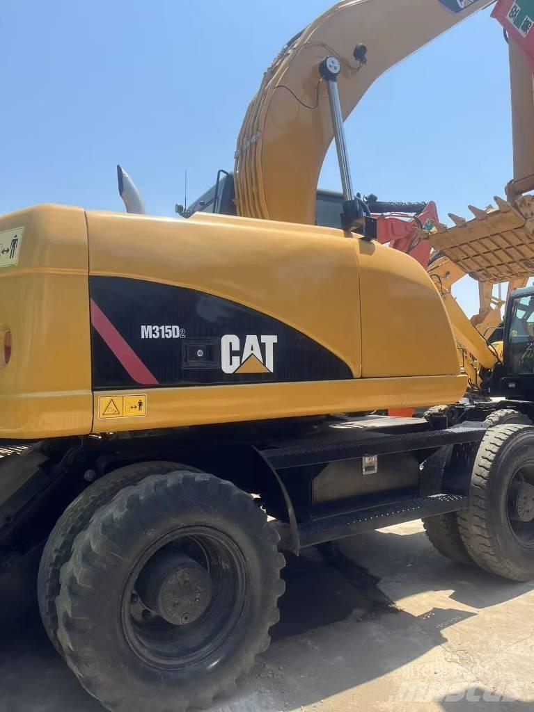 CAT 315 D Pelle sur pneus