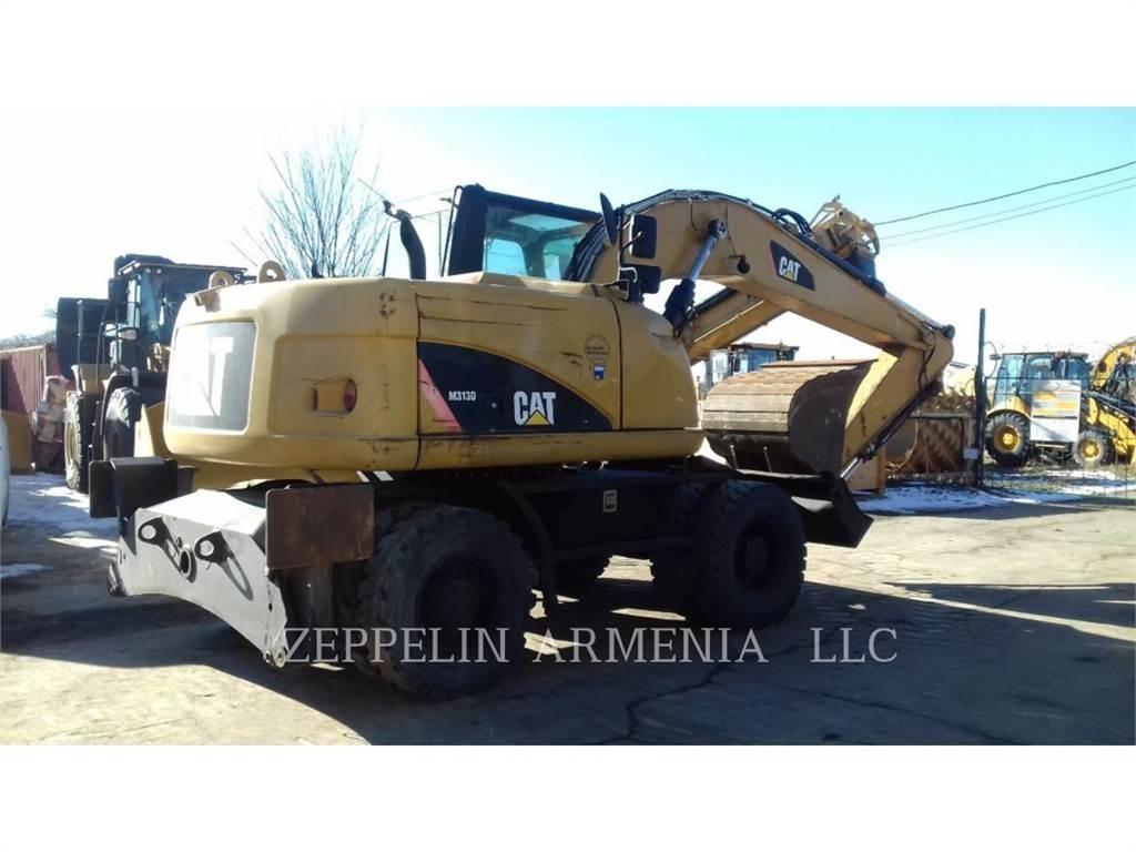 CAT M313D Pelle sur pneus