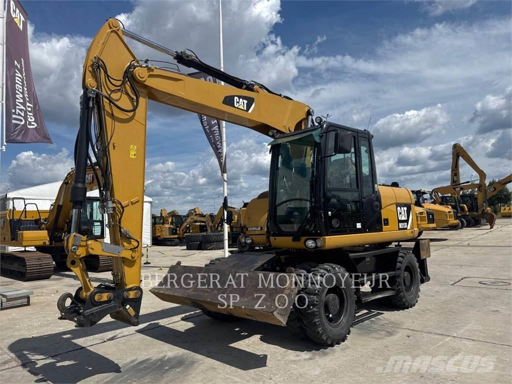 CAT M313D Pelle sur pneus