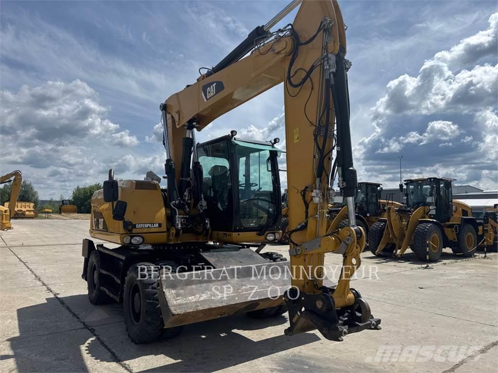 CAT M313D Pelle sur pneus