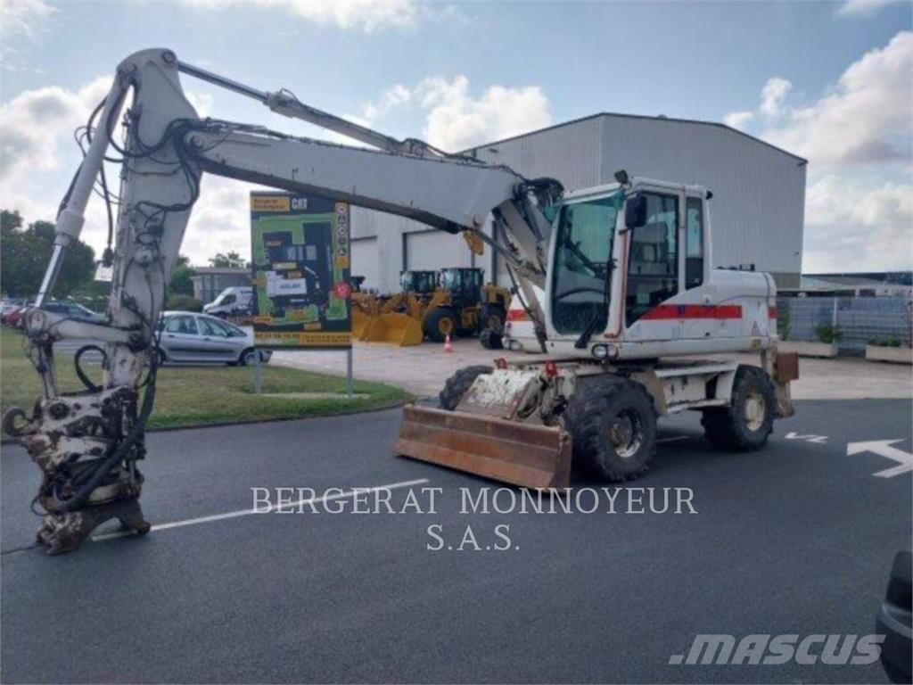 CAT M313D Pelle sur pneus