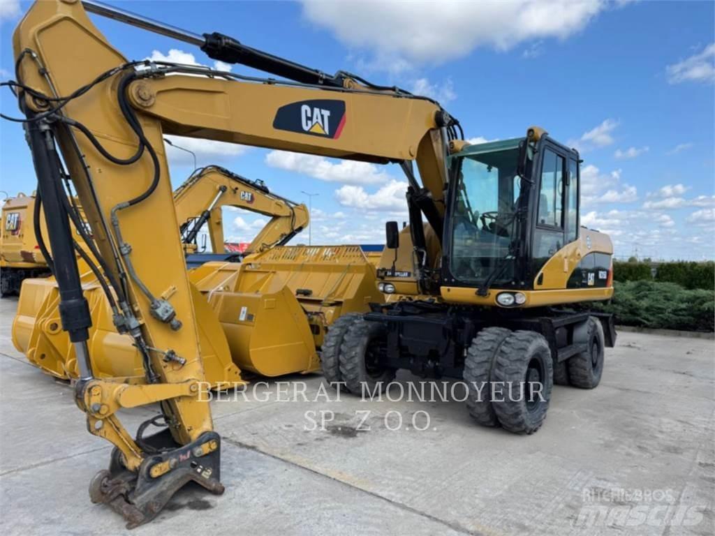 CAT M315D Pelle sur pneus