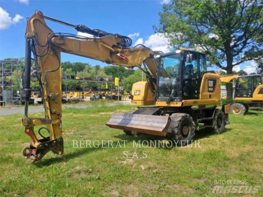 CAT M315F IVC Pelle sur pneus