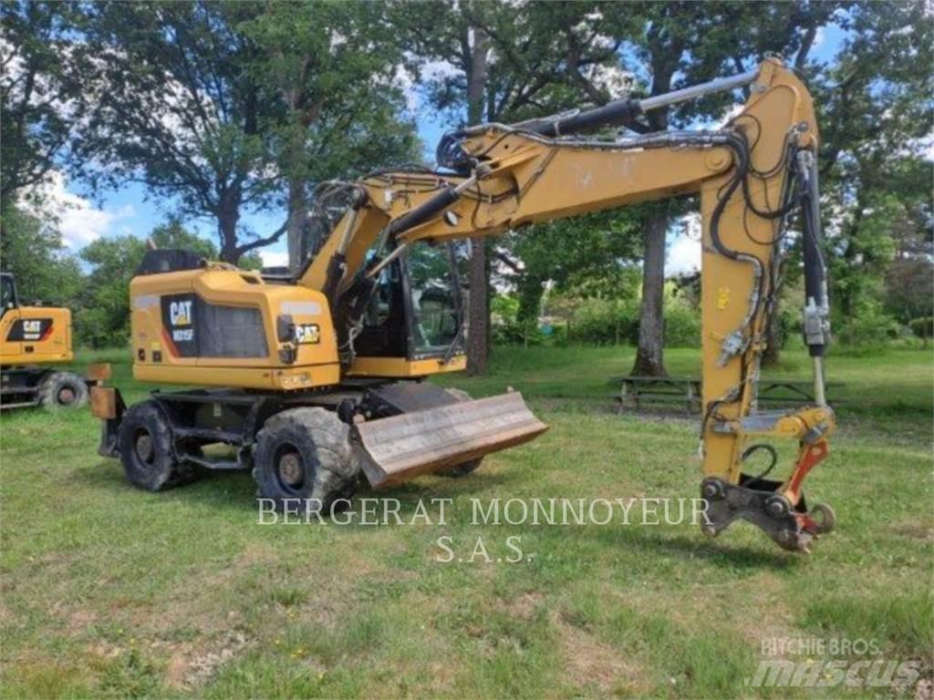 CAT M315F IVC Pelle sur pneus