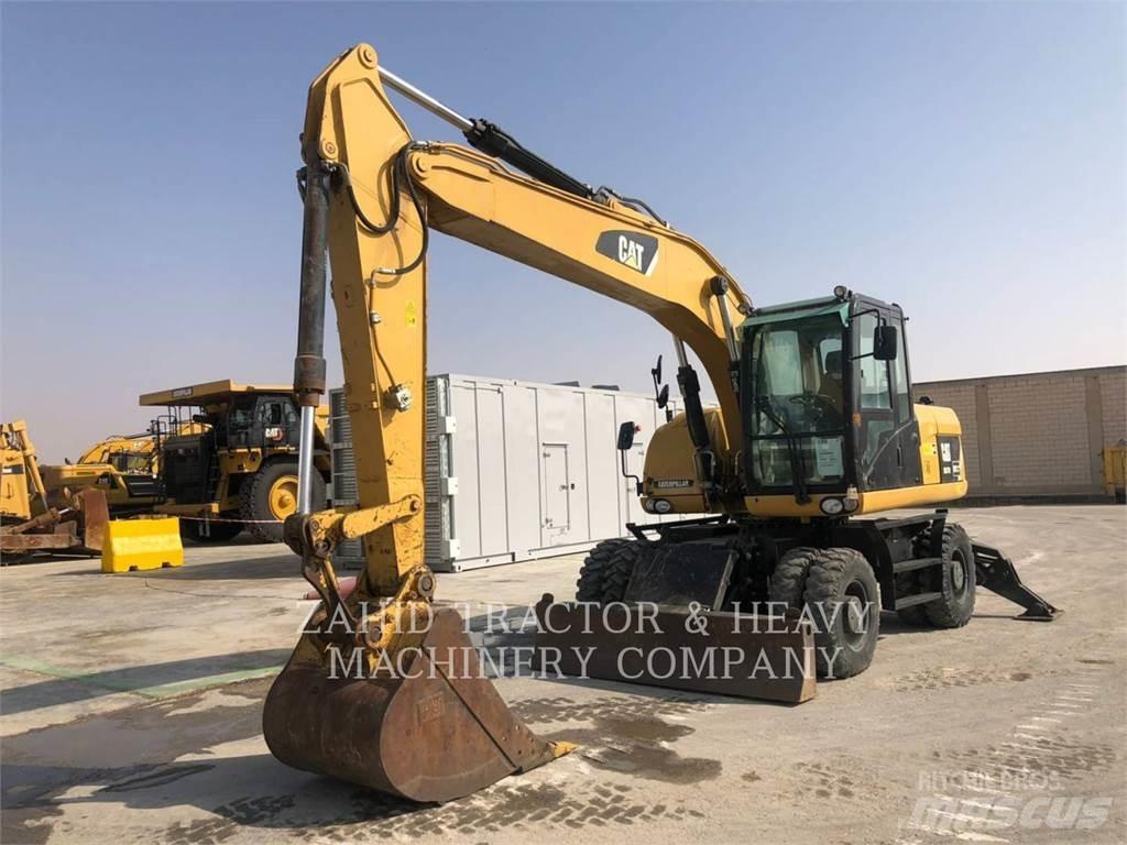 CAT M317D Pelle sur pneus