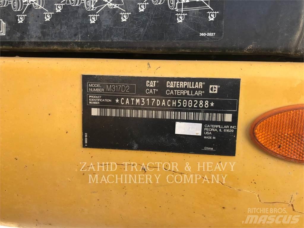 CAT M317D Pelle sur pneus