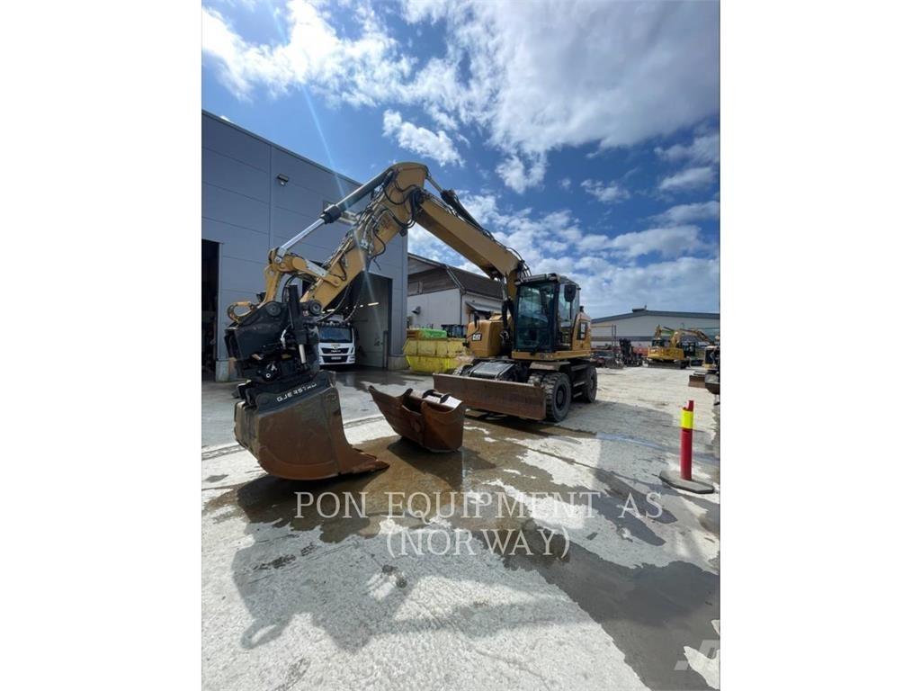 CAT M317F Pelle sur pneus