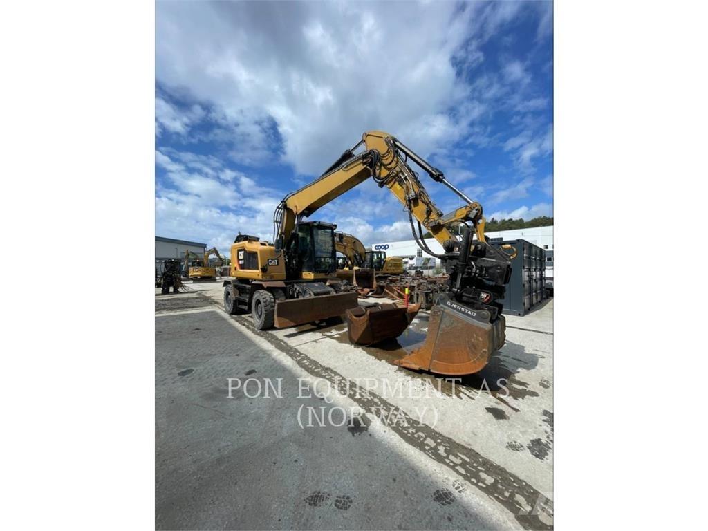 CAT M317F Pelle sur pneus