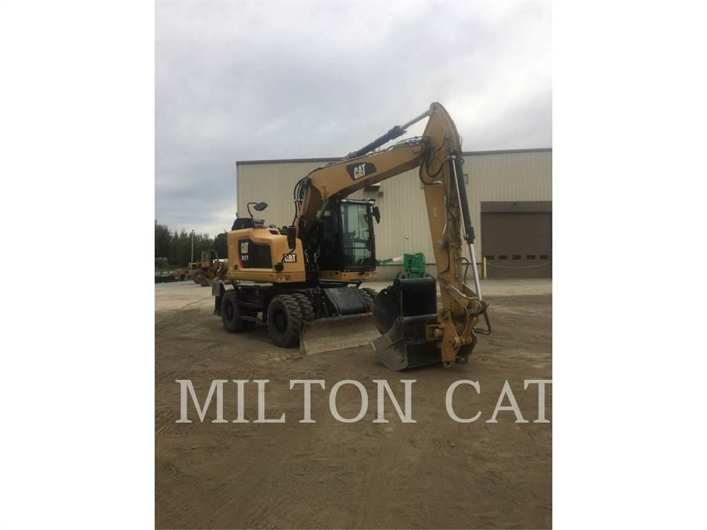 CAT M317F Pelle sur pneus