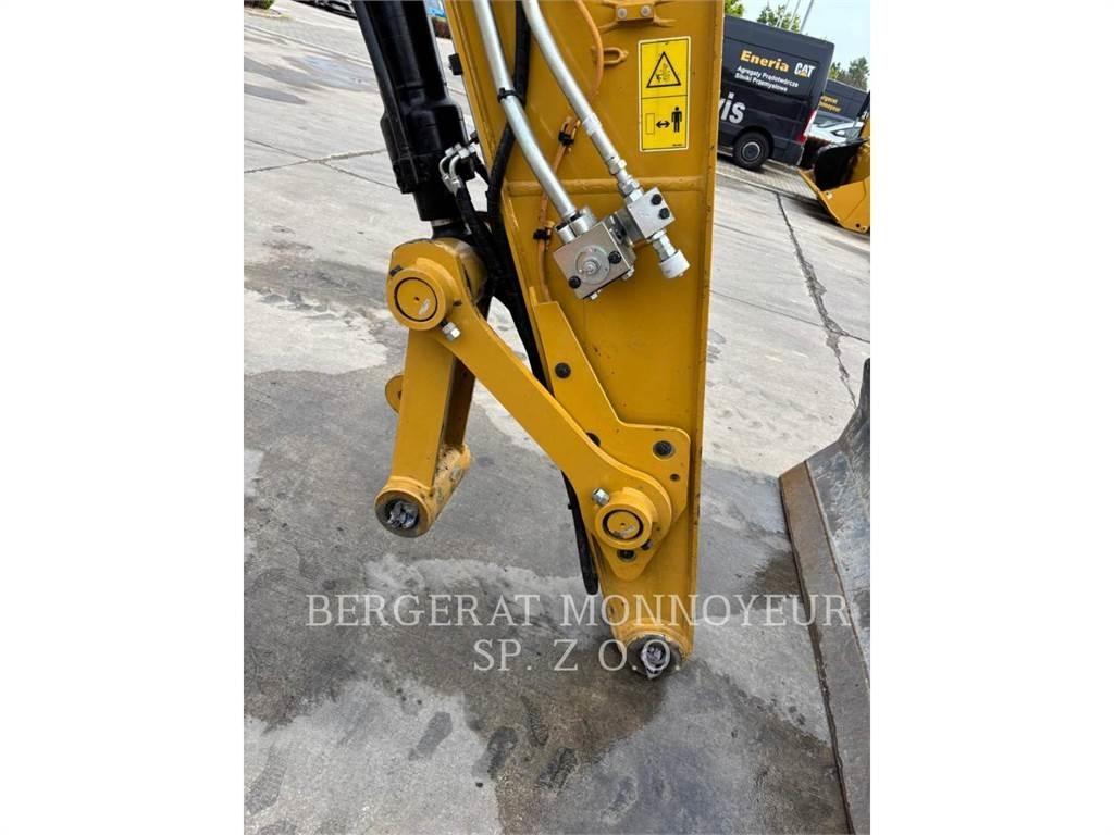 CAT M318 Pelle sur pneus