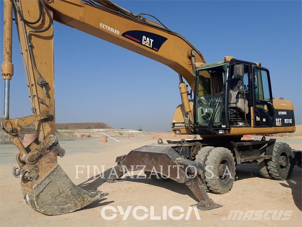 CAT M318 Pelle sur pneus