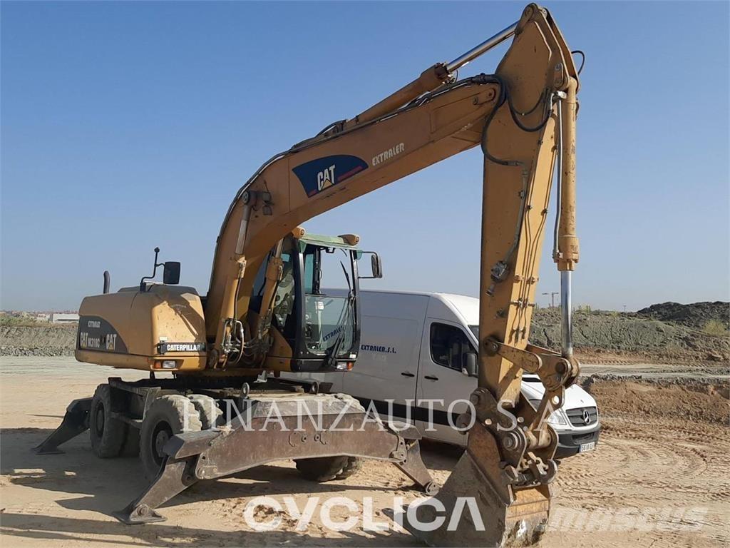 CAT M318 Pelle sur pneus