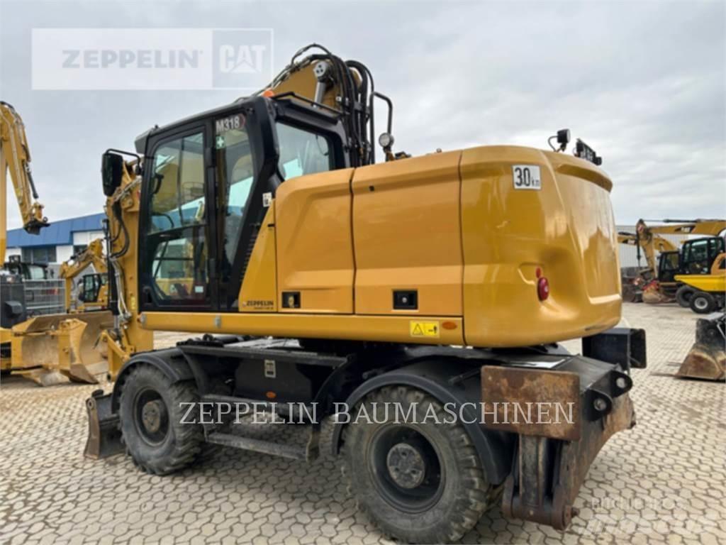 CAT M318-07A Pelle sur pneus