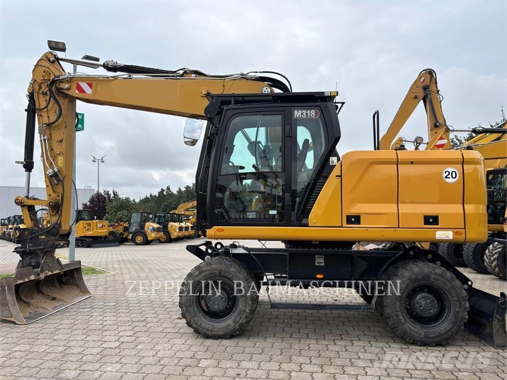 CAT M318-07A Pelle sur pneus