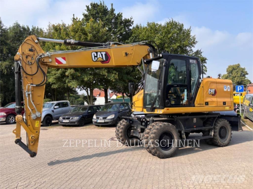 CAT M318-07A Pelle sur pneus