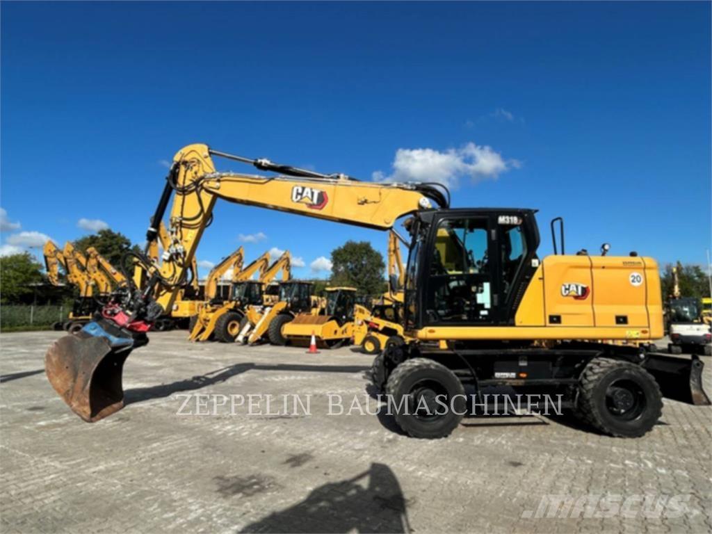 CAT M318-07A Pelle sur pneus
