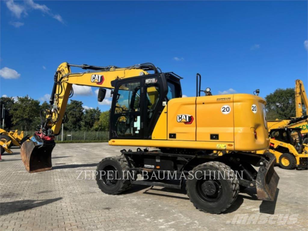 CAT M318-07A Pelle sur pneus
