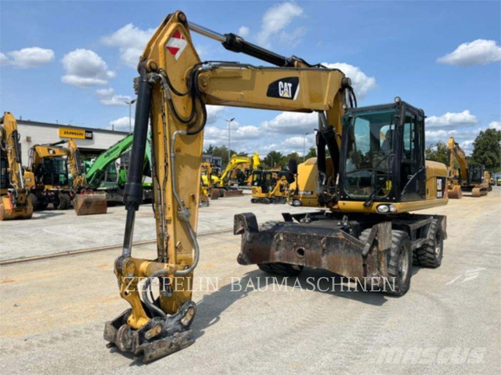 CAT M318D Pelle sur pneus