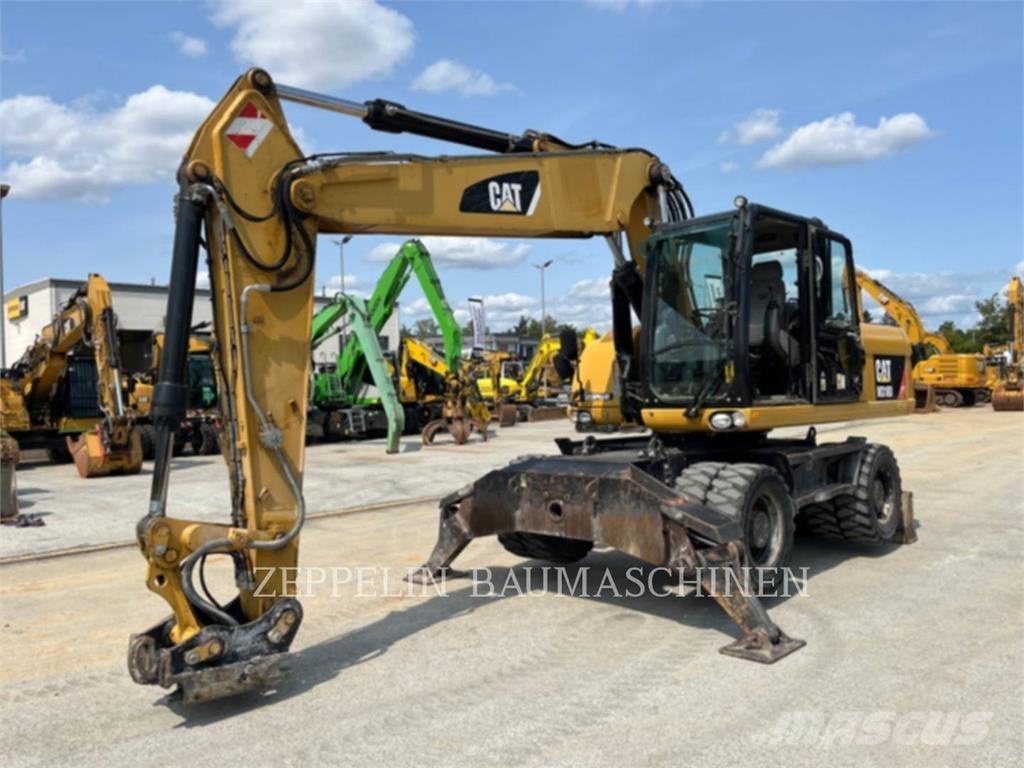 CAT M318D Pelle sur pneus