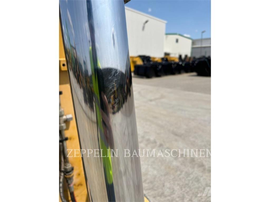 CAT M318D Pelle sur pneus