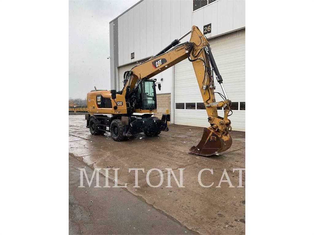 CAT M318F Pelle sur pneus