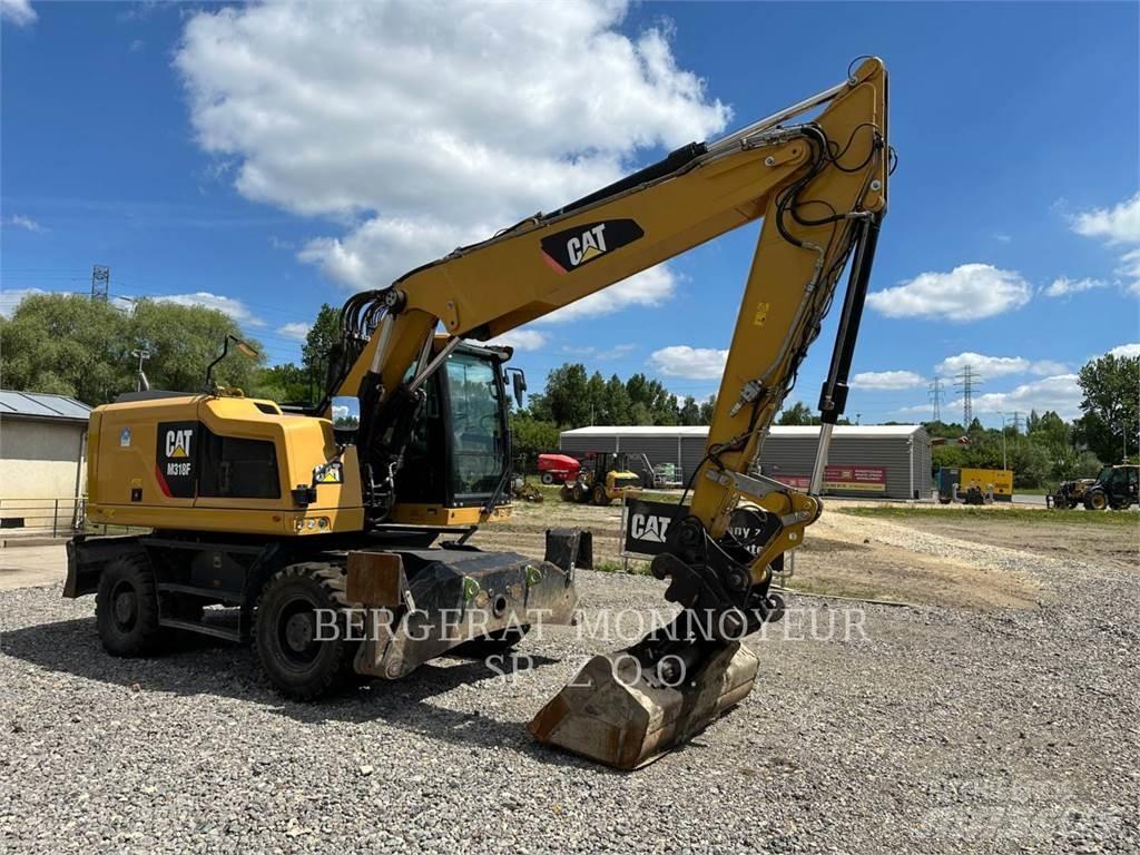 CAT M318F Pelle sur pneus