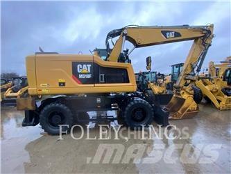 CAT M318F Pelle sur pneus