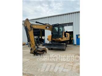 CAT M318F Pelle sur pneus