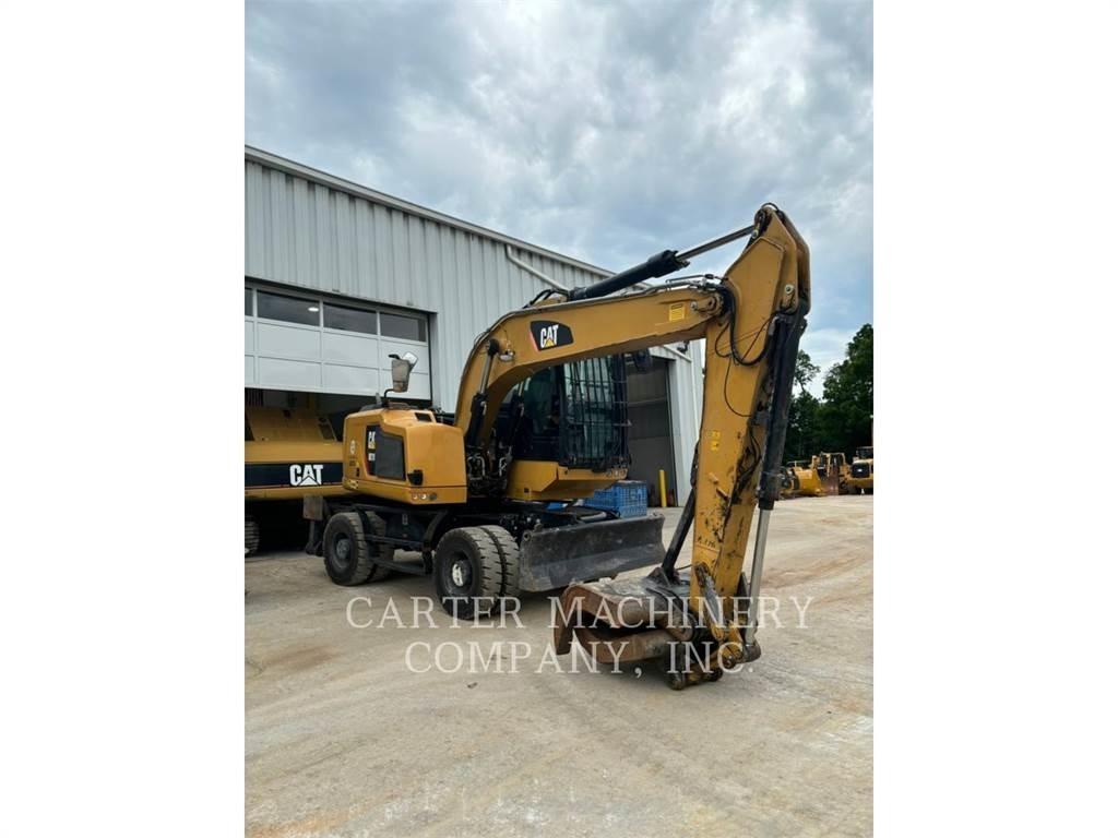 CAT M318F Pelle sur pneus