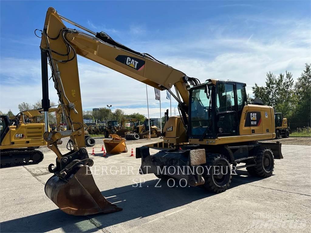 CAT M318F Pelle sur pneus