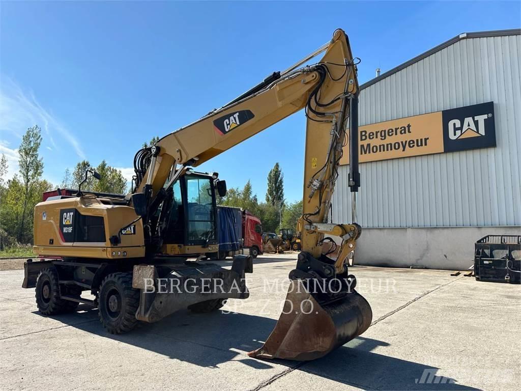 CAT M318F Pelle sur pneus