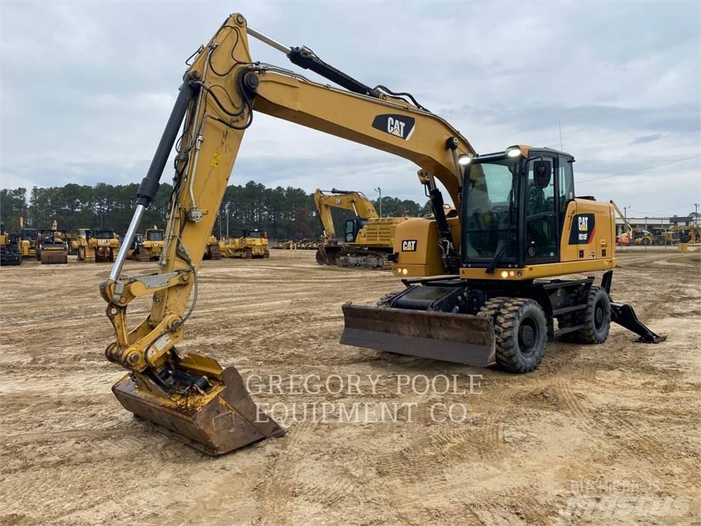 CAT M318F Pelle sur pneus