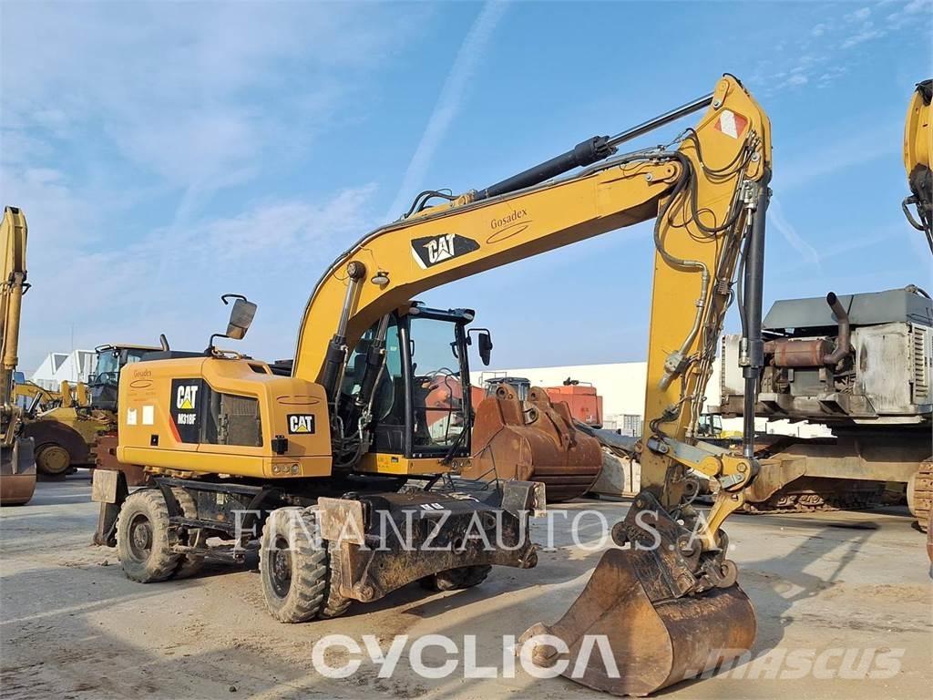 CAT M318F Pelle sur pneus